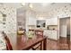 Eat-in kitchen area showcasing stainless steel appliances, dark wood floors, and natural light at 752 Pinebough Ln, Rock Hill, SC 29732