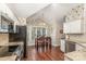 Eat-in kitchen area showcasing stainless steel appliances, dark wood floors, and natural light at 752 Pinebough Ln, Rock Hill, SC 29732