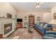 Inviting living room with a fireplace, plush sofa, and a stylish area rug at 752 Pinebough Ln, Rock Hill, SC 29732