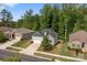 Beautiful suburban home with manicured lawns, surrounded by lush greenery, showcasing curb appeal and neighborhood charm at 7620 Porrera St, Charlotte, NC 28214