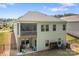 Two-story home with a screened porch and outdoor seating, plus a fenced yard surrounded by mature trees at 7620 Porrera St, Charlotte, NC 28214