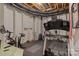 Unfinished basement with exercise equipment, offering potential for customization at 7620 Porrera St, Charlotte, NC 28214
