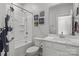 Clean bathroom with shower, toilet, and vanity with quartz countertop at 7620 Porrera St, Charlotte, NC 28214