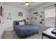 Comfortable bedroom featuring stylish decor, accent wall, and natural light from the window at 7620 Porrera St, Charlotte, NC 28214
