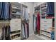 Well-organized walk-in closet with built-in shelves, drawers, and hanging rods at 7620 Porrera St, Charlotte, NC 28214