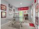 Game room with ping pong table, Ohio State decor, and natural light at 7620 Porrera St, Charlotte, NC 28214