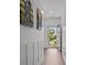 Hallway with board and batten wainscoting and door to the outside at 7620 Porrera St, Charlotte, NC 28214