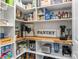 Walk-in pantry with custom shelving, wood countertop, and organized storage at 7620 Porrera St, Charlotte, NC 28214