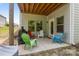 Cozy patio with colorful chairs and a grill, ideal for outdoor entertaining and relaxation at 7620 Porrera St, Charlotte, NC 28214