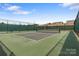 Well-maintained pickleball court with a green surface, ready for friendly matches and exercise at 7620 Porrera St, Charlotte, NC 28214