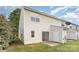 Exterior shows the back of the home, back patio, storage, and sliding glass door at 7718 Petrea Ln, Charlotte, NC 28227