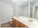 Bathroom featuring double sink vanity and wood-look flooring at 7718 Petrea Ln, Charlotte, NC 28227