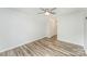 Bedroom showcasing wood-look flooring, closet, and neutral walls at 7718 Petrea Ln, Charlotte, NC 28227