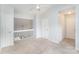 Upstairs bedroom with neutral carpet, vaulted ceiling, and fan at 7718 Petrea Ln, Charlotte, NC 28227