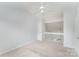 Upstairs bedroom with neutral carpet, vaulted ceiling, and fan at 7718 Petrea Ln, Charlotte, NC 28227