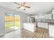 Bright kitchen with stainless steel appliances and a view of the backyard through a sliding glass door at 7718 Petrea Ln, Charlotte, NC 28227