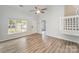 Living room featuring hardwood floors, natural light, and an open floor plan at 7718 Petrea Ln, Charlotte, NC 28227