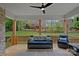 Inviting back porch with cozy seating and a ceiling fan, perfect for outdoor relaxation at 7730 Burning Ridge Dr, Stanley, NC 28164