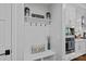Hallway with modern wainscoting and a convenient drop zone, perfect for organization at 7730 Burning Ridge Dr, Stanley, NC 28164