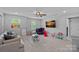 Bright playroom with ample space for activities, featuring natural light and comfortable seating at 7730 Burning Ridge Dr, Stanley, NC 28164