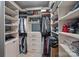 Organized walk-in closet with custom shelving, drawers, and hanging space for clothes and accessories at 7730 Burning Ridge Dr, Stanley, NC 28164