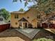 Back of house with patio, trees, and a fenced yard; great for entertaining and relaxing outdoors at 7923 Shiny Meadow Ln, Charlotte, NC 28215