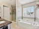 Bathroom with a soaking tub and walk-in shower at 7923 Shiny Meadow Ln, Charlotte, NC 28215