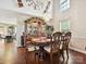 Dining room features a decorative chandelier and a china cabinet with dining table at 7923 Shiny Meadow Ln, Charlotte, NC 28215
