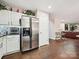 Bright kitchen with stainless steel appliances, hardwood floors and easy access to the cozy living room at 7923 Shiny Meadow Ln, Charlotte, NC 28215