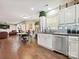 View of the kitchen, dining area and living room featuring an open concept design with hardwood floors at 7923 Shiny Meadow Ln, Charlotte, NC 28215