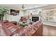 Comfortable living room area with hardwood floors, fireplace and mounted TV at 7923 Shiny Meadow Ln, Charlotte, NC 28215