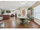 The open concept shows the dining and living room area with fireplace and access to the outdoors at 7923 Shiny Meadow Ln, Charlotte, NC 28215