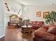 Spacious living area with high ceilings, hardwood floors, and elegant furnishings at 7923 Shiny Meadow Ln, Charlotte, NC 28215