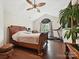 A spacious bedroom features a vaulted ceiling, hardwood floors and a treadmill for exercise at 7923 Shiny Meadow Ln, Charlotte, NC 28215