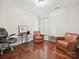 Office space with hardwood floors and comfortable seating, perfect for work or relaxation at 7923 Shiny Meadow Ln, Charlotte, NC 28215
