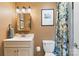 Cozy bathroom with nature-themed shower curtain, sink and neutral color walls at 808 Sharon Dr, Waxhaw, NC 28173