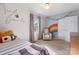 Bedroom with rainbow wall decor, comfortable chair and plenty of natural light at 808 Sharon Dr, Waxhaw, NC 28173