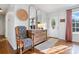 The foyer has hardwood floors, a decorative chair and table, with 2 large mirrors above the table at 808 Sharon Dr, Waxhaw, NC 28173