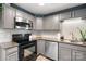 Efficient kitchen space boasting granite countertops, subway tile, and modern appliances at 808 Sharon Dr, Waxhaw, NC 28173