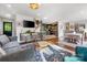 Open concept living room flowing into kitchen and dining area with stylish decor at 808 Sharon Dr, Waxhaw, NC 28173