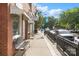 Charming downtown sidewalk with a classic barber shop, seating, and decorative street lamps in Mebane at 808 Sharon Dr, Waxhaw, NC 28173