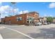 Brick building with storefronts, showing the architectural style of downtown Mebane, North Carolina at 808 Sharon Dr, Waxhaw, NC 28173