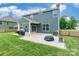 Lovely home backyard with patio, grassy area, and exterior view of the house at 9109 Loch Glen Way, Charlotte, NC 28278