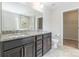 Modern bathroom with dual sinks, granite countertop, and walk-in shower at 9109 Loch Glen Way, Charlotte, NC 28278