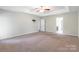 Bright bedroom with a ceiling fan and a view of the ensuite bath at 9109 Loch Glen Way, Charlotte, NC 28278