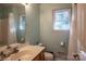 Bathroom featuring a shower/tub combo and a commode at 9801 Kent Village Dr, Charlotte, NC 28269