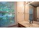 Bathroom with a window bringing in natural light at 9801 Kent Village Dr, Charlotte, NC 28269