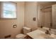 Bathroom featuring a vanity with a sink and commode at 9801 Kent Village Dr, Charlotte, NC 28269
