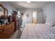 Bedroom with neutral walls and plenty of space at 9801 Kent Village Dr, Charlotte, NC 28269