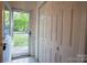 Bright entryway featuring a storm door providing views to the front yard at 9801 Kent Village Dr, Charlotte, NC 28269
